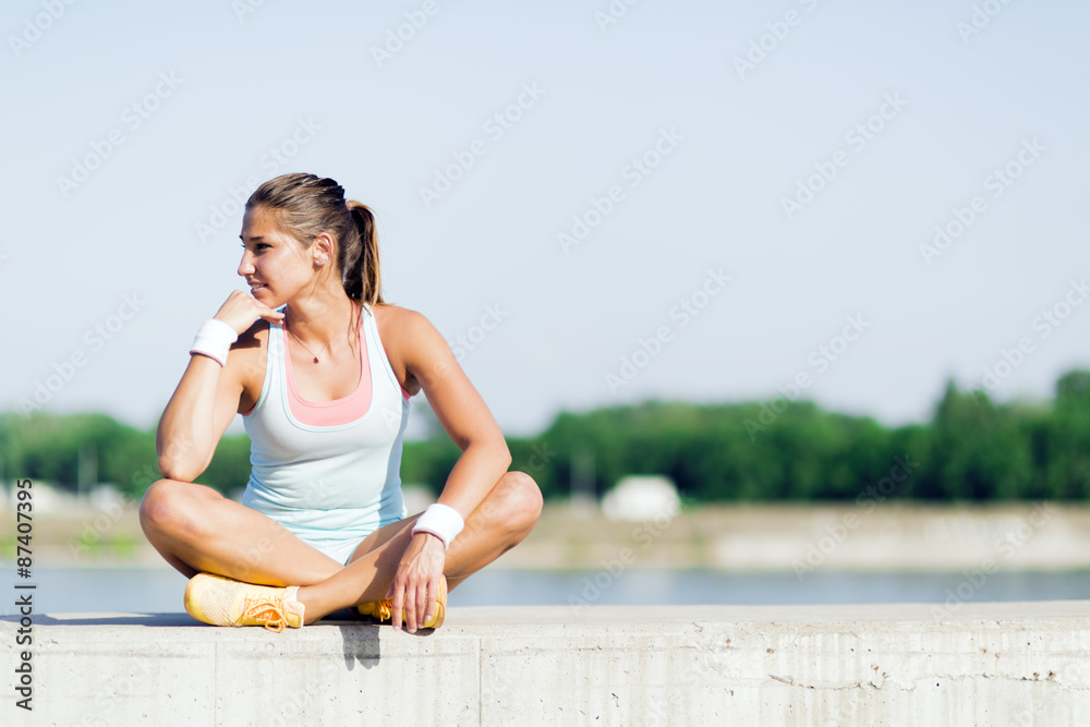 Young woman stretching and relaxing in the city Young woman stretching and relaxing in the city