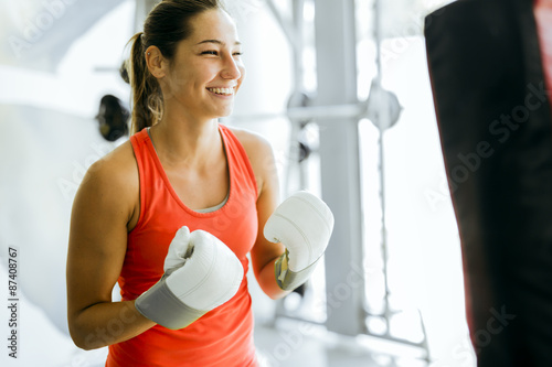 Young woman boxing and training