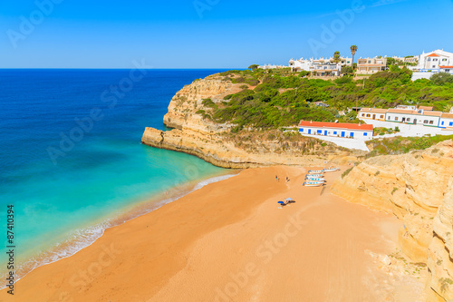View of paradise beach with turquoise sea water in Benagil fishing village, Algarve, Portugal