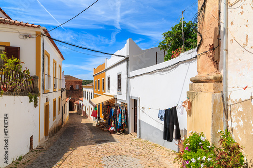 Narrow street in old town of Silves with colorful houses, Portugal © pkazmierczak
