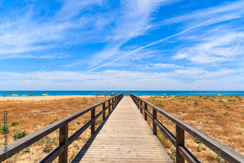 Walkway to sandy beach in Armacao de Pera coastal town  Algarve region  Portugal