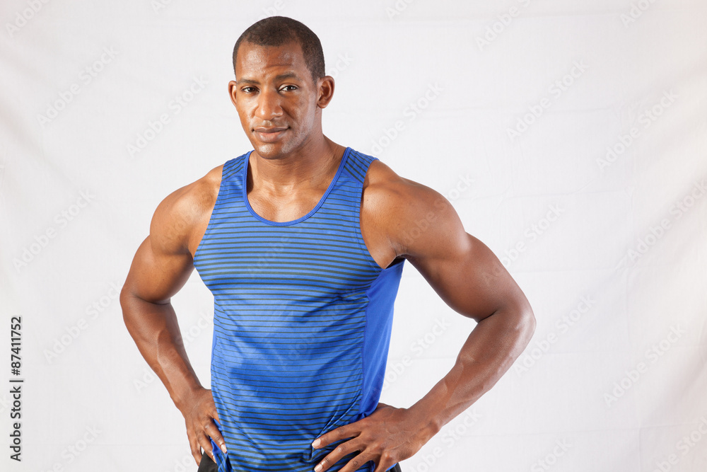 Smiling black man with hands on his hips Smiling black man with hands on his hips