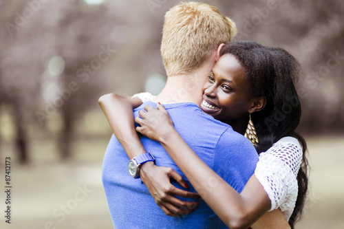 Couple in love hugging peacfully outdoors photo