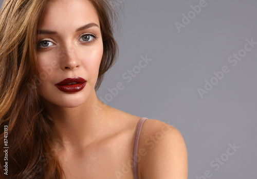 Portrait of beautiful woman , isolated on gray background