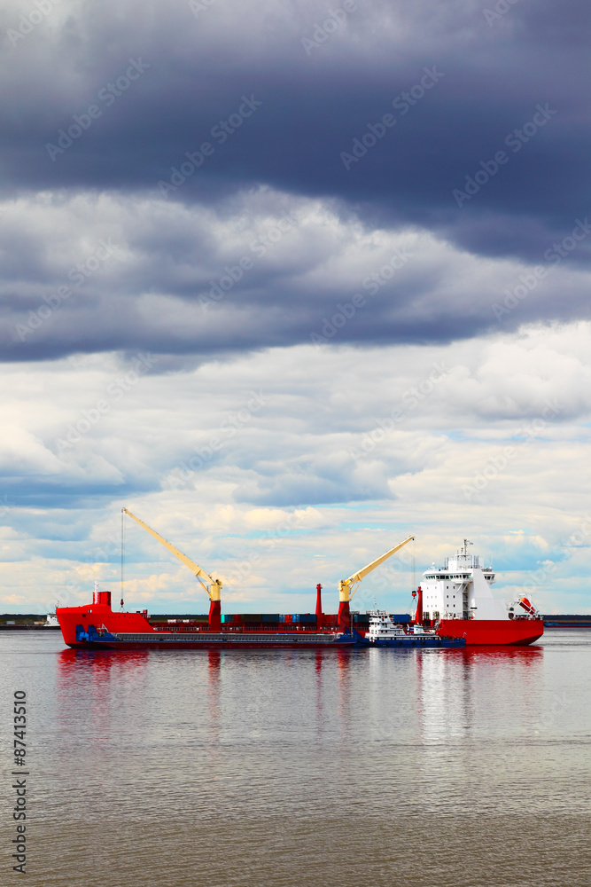 cargo ship sailing on the river