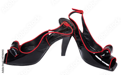 Black high heel patent leather women shoes on white background