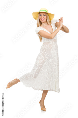 Woman in long summer dress and hat isolated on white