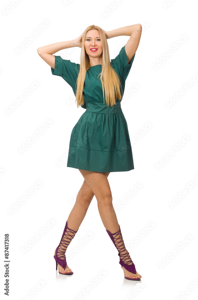 Young woman in green dress isolated on white