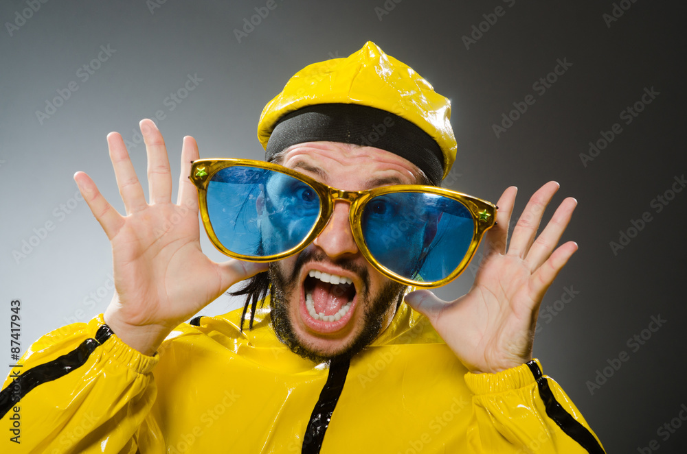 Man wearing yellow suit in funny concept