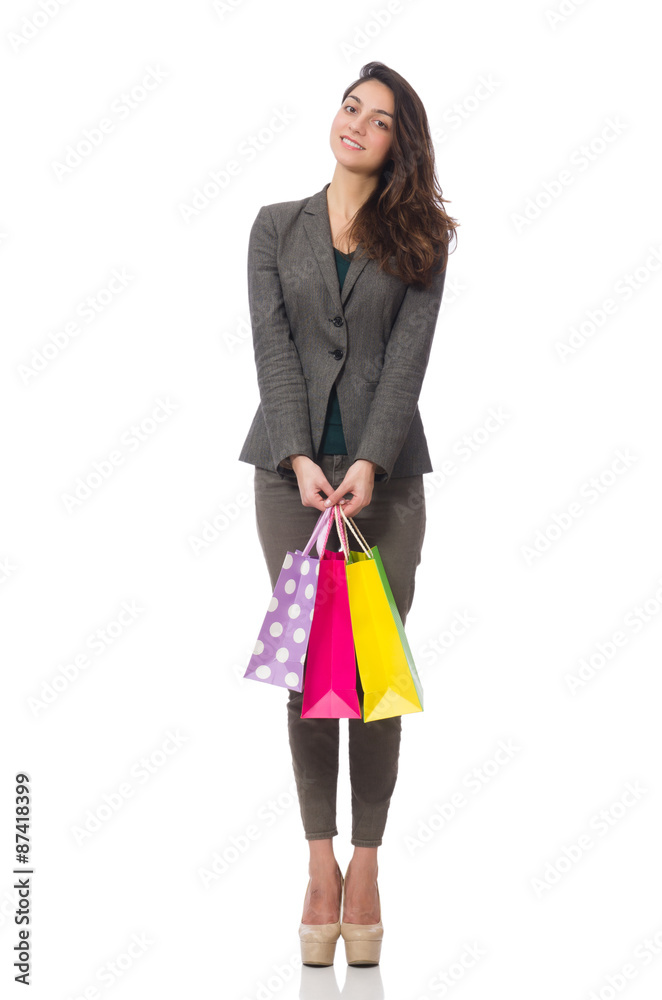 Attractive woman with shopping bags isolated on white