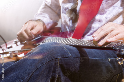 Professional Guitar Player with Electric Guitar Hands Closeup. S © danmorgan12