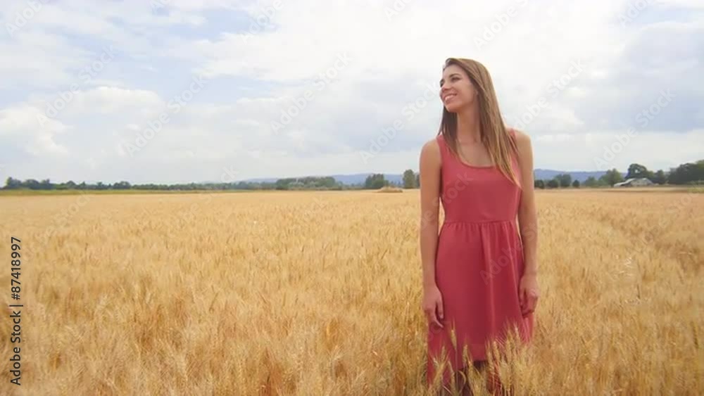 Beautiful Brunette Standing in a Wheat Field Beautiful Brunette Standing in a Wheat Field