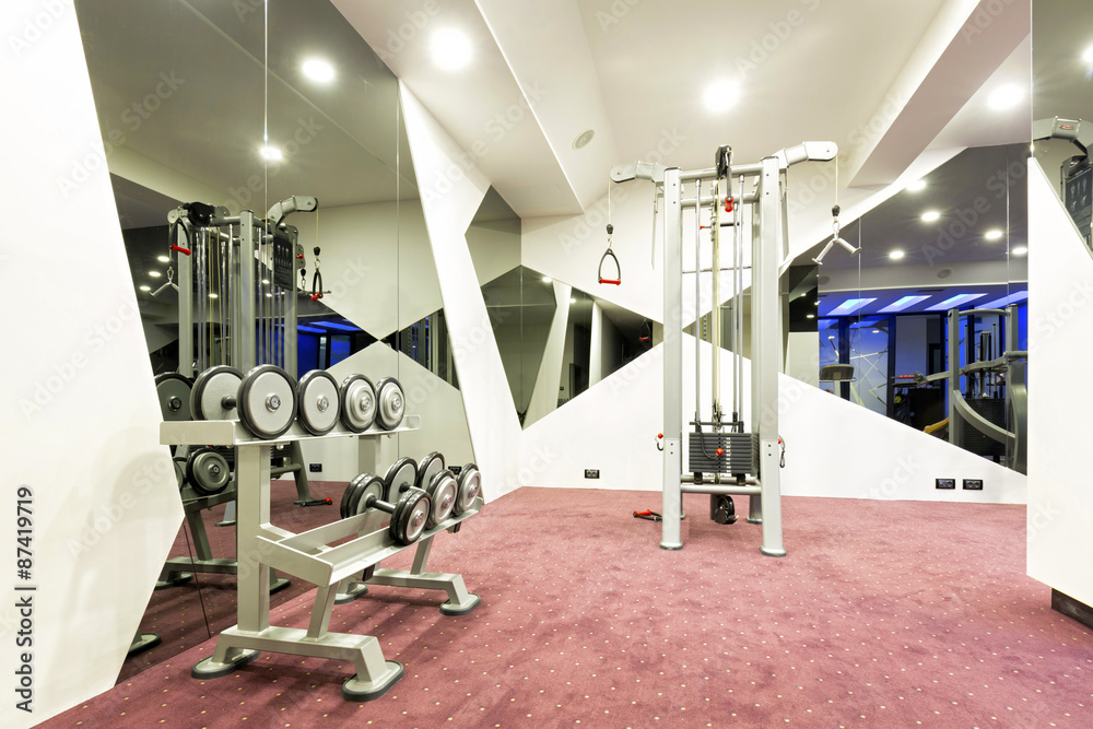 Interior of a gym with equipment Interior of a gym with equipment