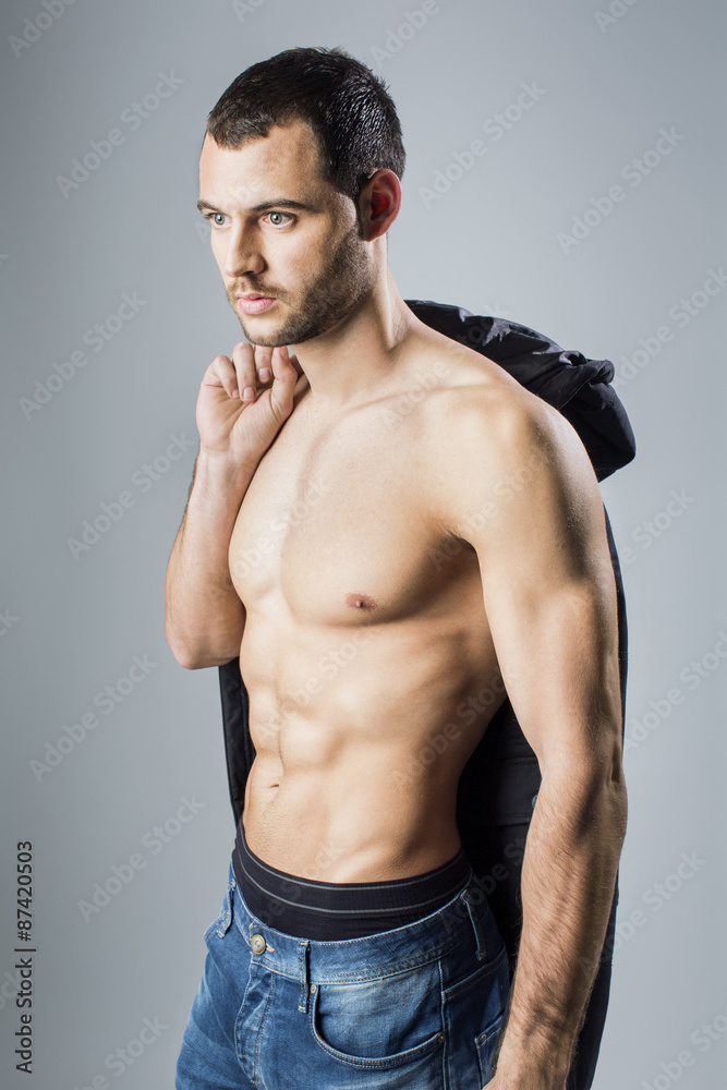 Fototapeta premium Handsome muscular man in jeans