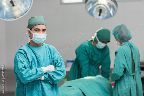 Surgical team with arms crossed in an operating theater