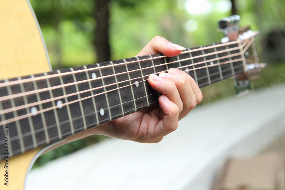 Obraz premium Bending the guitar string