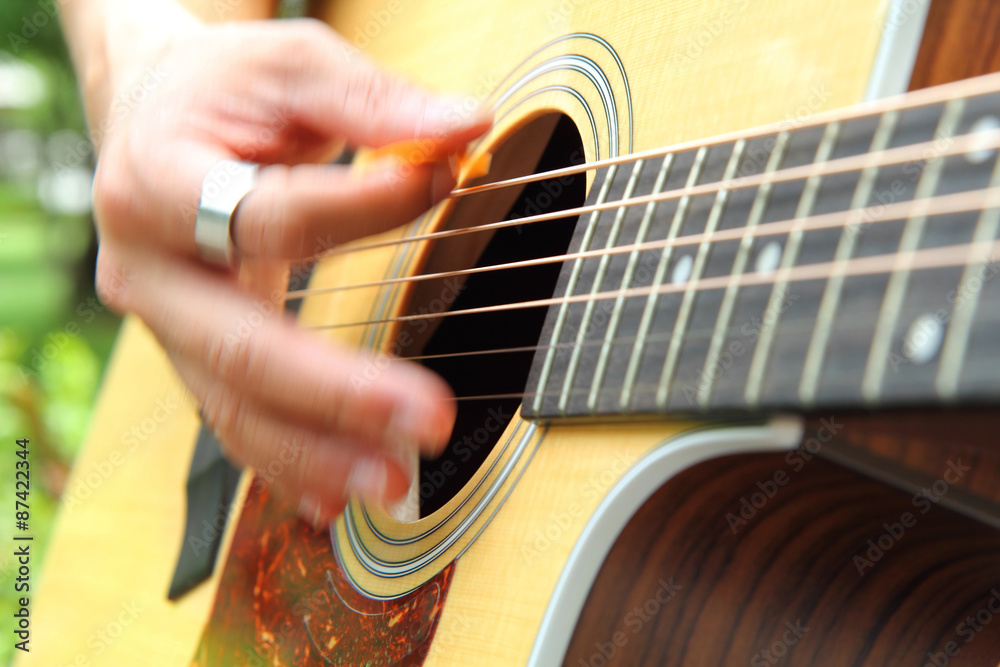 Obraz premium Blur hand with playing the guitar