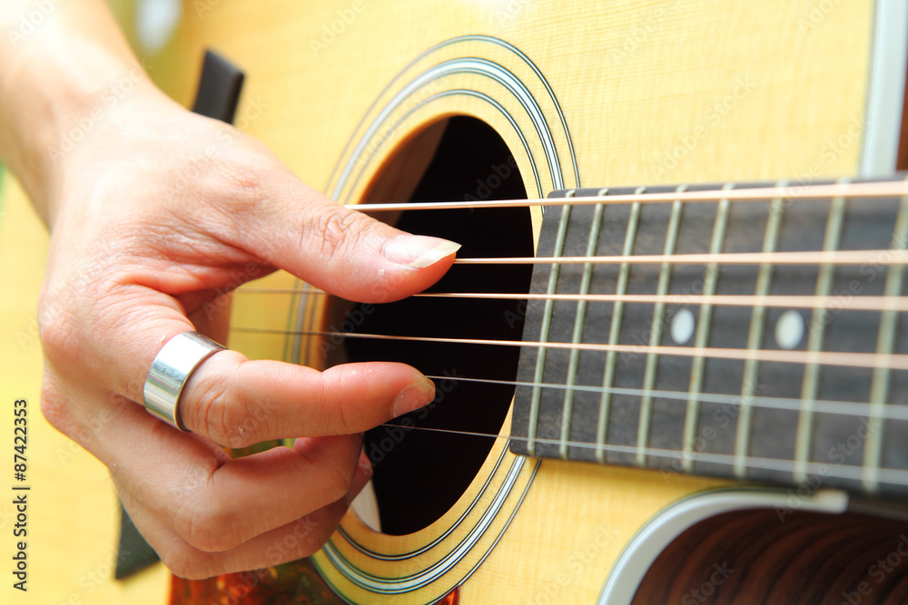 Fototapeta premium Finger picking the guitar