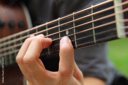 playing the guitar / finger board