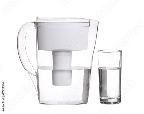 water filter jug with glass of clean water isolated on white bac