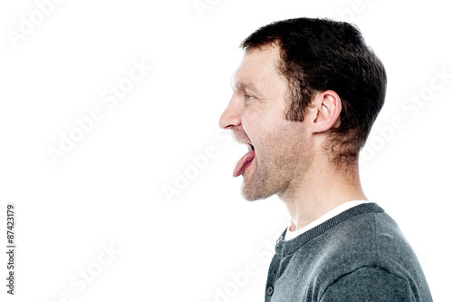 Man showing his tongue out