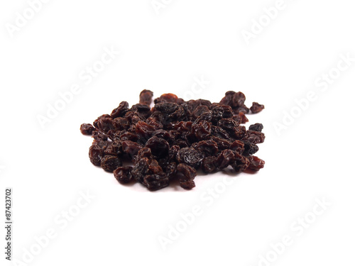 fresh organic raisins on white background