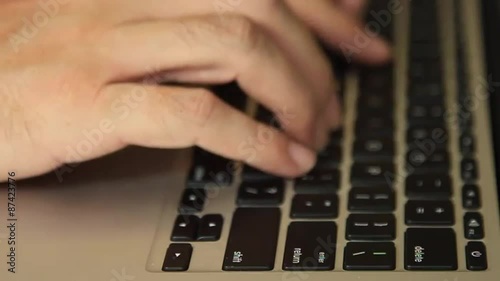 Hands typing and hitting the Return key