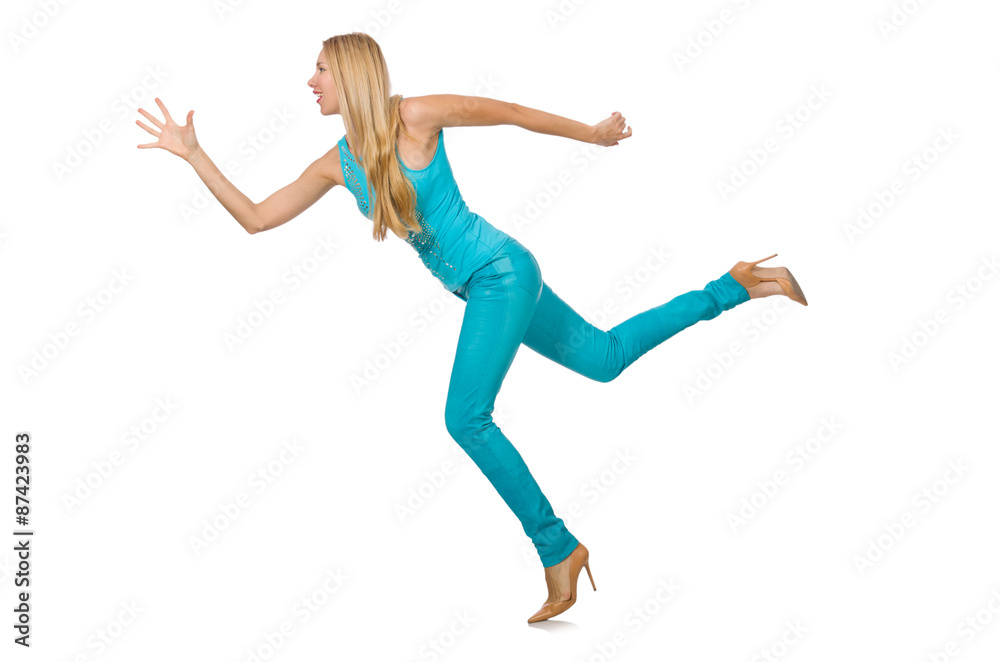 Pretty blond woman in blue pants and shirt isolated on white