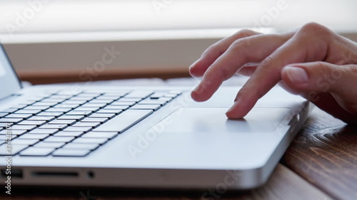 Working on laptop touchpad photo