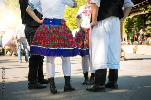 Anonymous group of people in folklore costumes