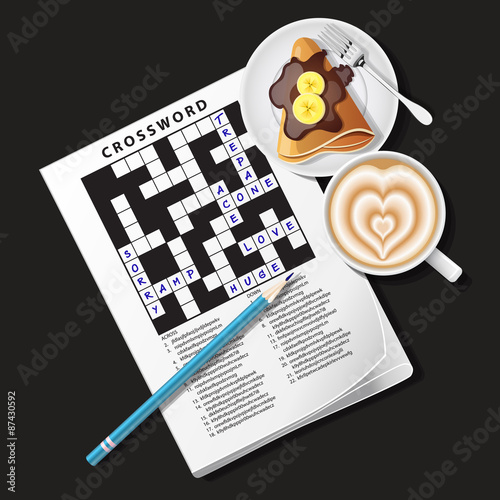 crossword game with mug of coffee and crepe