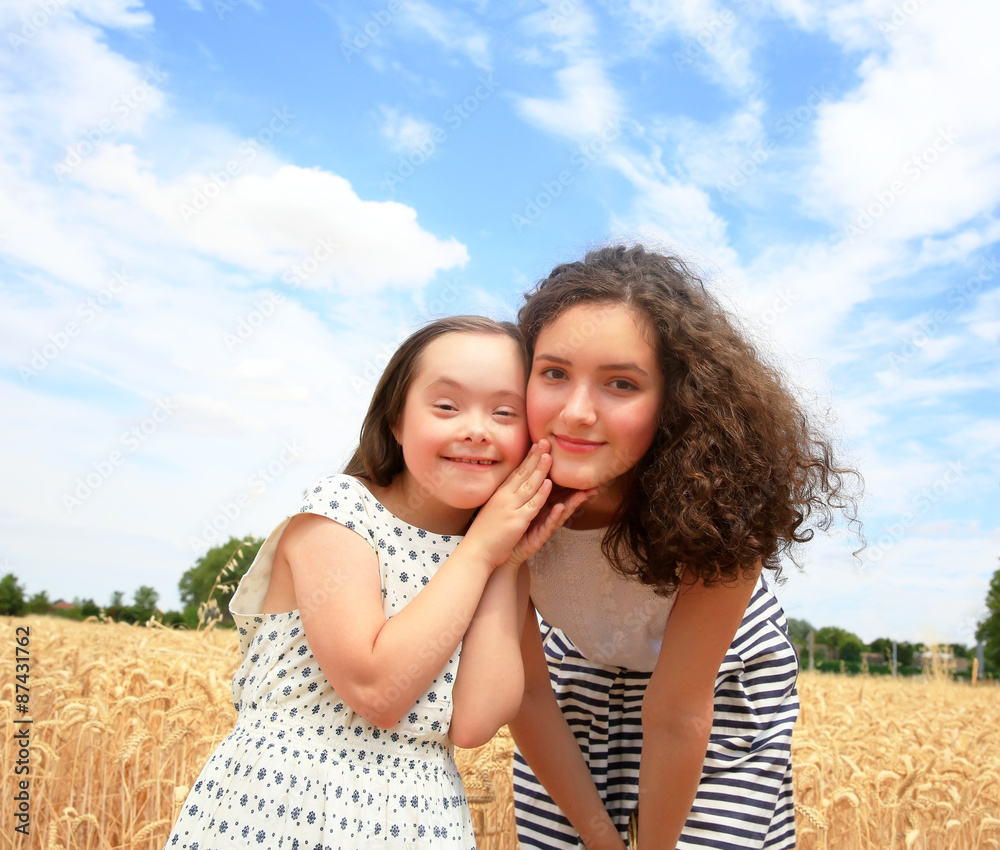 Young girls having fun ln the wheat field Young girls having fun ln the wheat field
