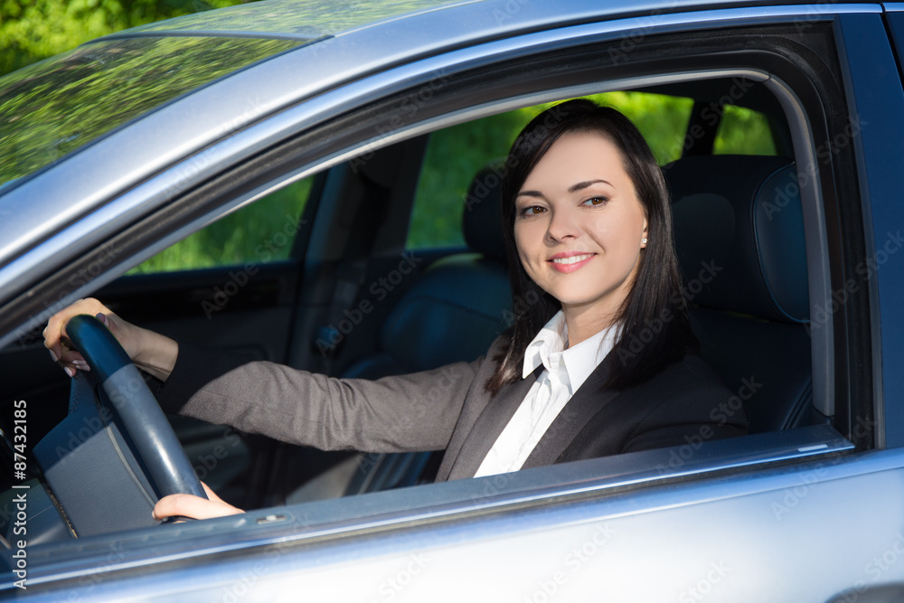 young business woman driving her car