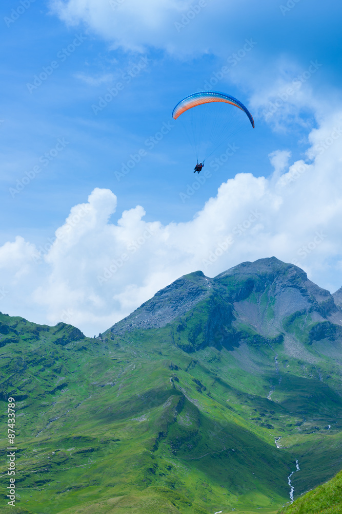 parasailing over the mountains among the clouds parasailing over the mountains among the clouds