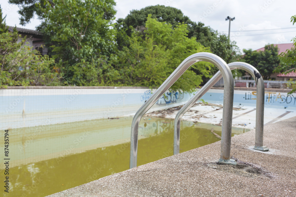 The old concrete swimming pool 