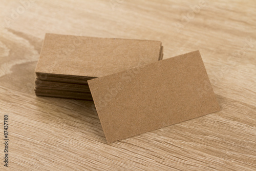 Kraft business cards on a wooden background