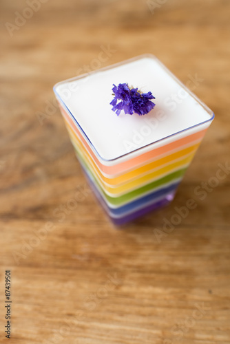 Rainbow Jelly on Wooden Background