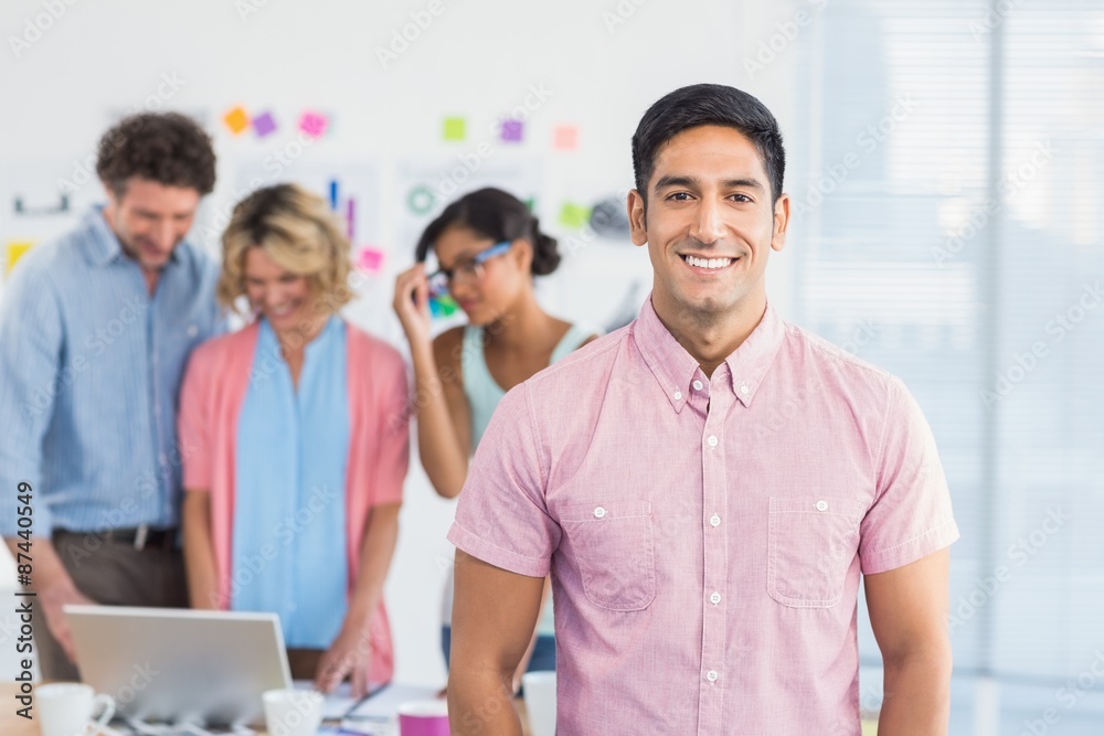 Casual business team having a meeting using laptop Casual business team having a meeting using laptop
