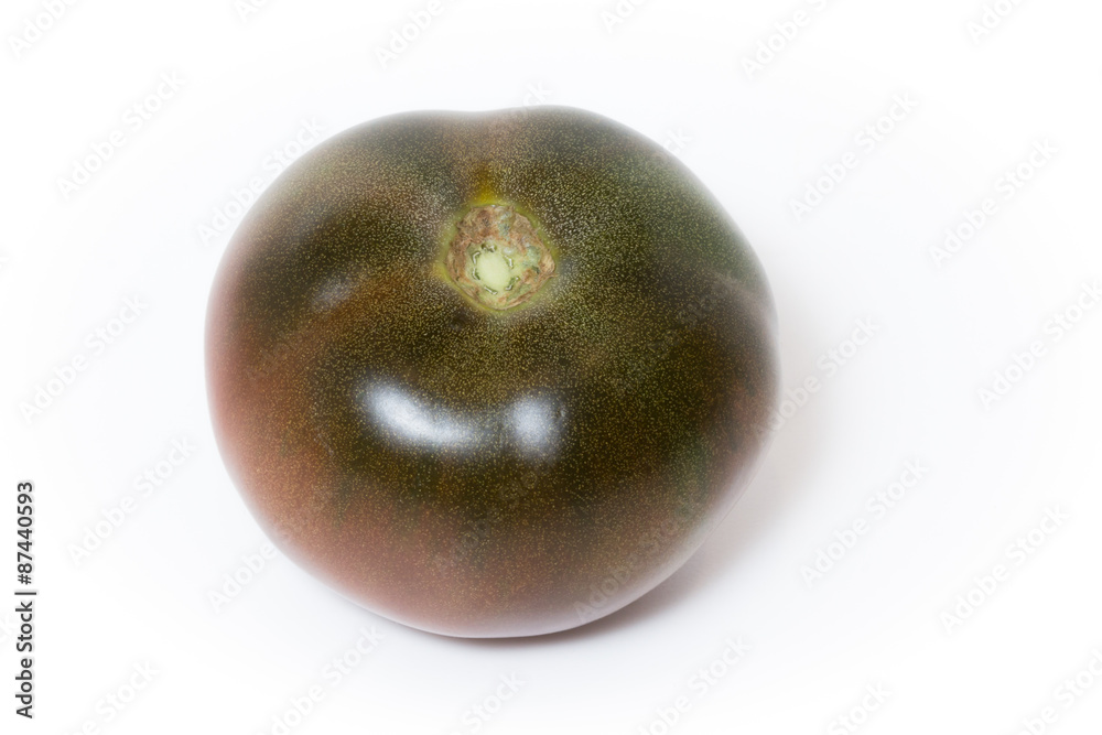 Tomato kumato isolated on white background. Tomato kumato isolated on white background.