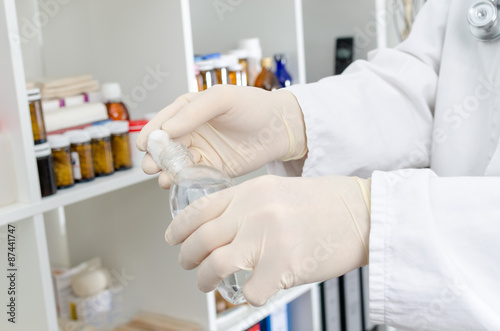 Doctor putting disinfectant on a piece of cotton