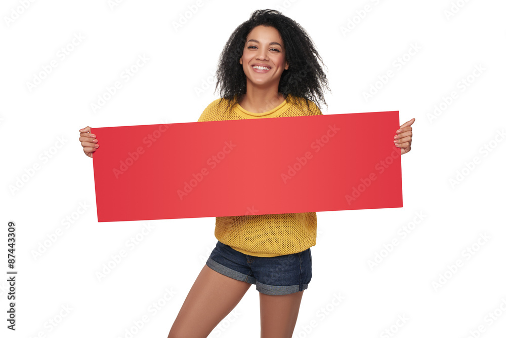 Happy african american girl showing blank banner