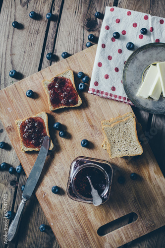 Toast bread with wild strawberry jam. Retro,vintage filter