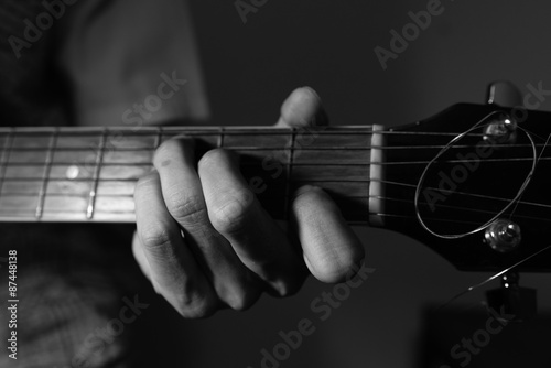 Black and White Photo of a Guy Playing Guitar in Key C Major