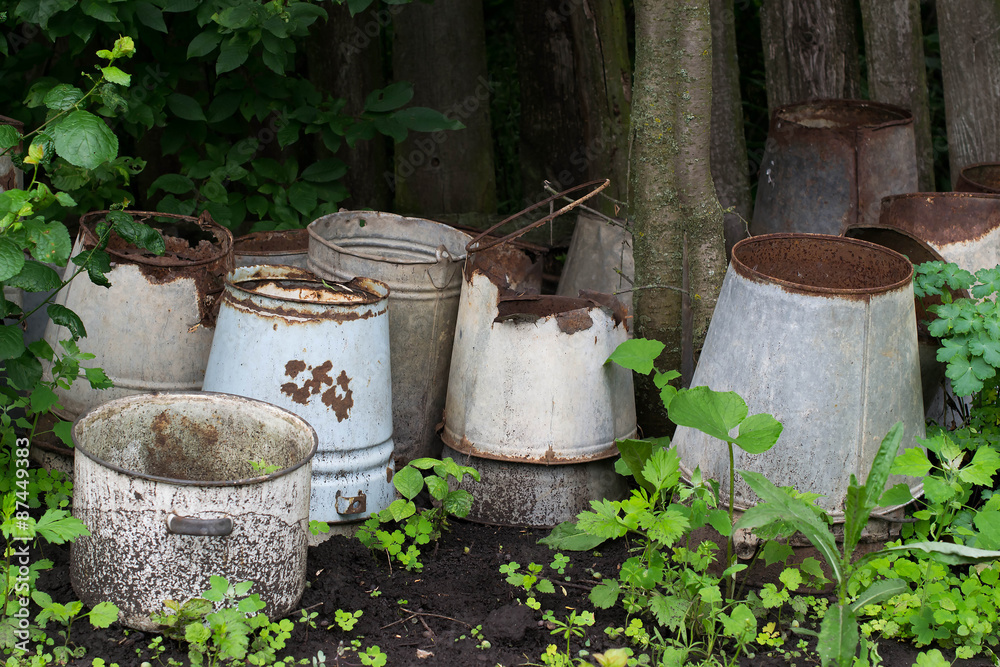 The old leaky bucket near the fence The old leaky bucket near the fence