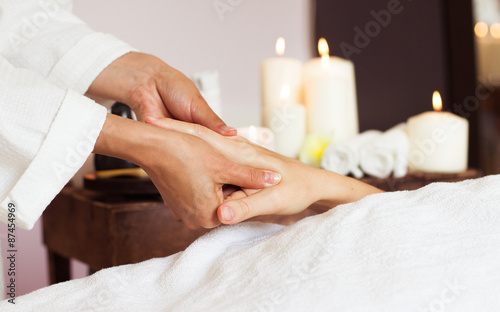 Close-up. Woman receiving a hand massage at the health spa.