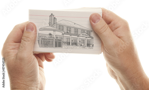 Male Hands Holding Stack of Flash Cards with House Drawing