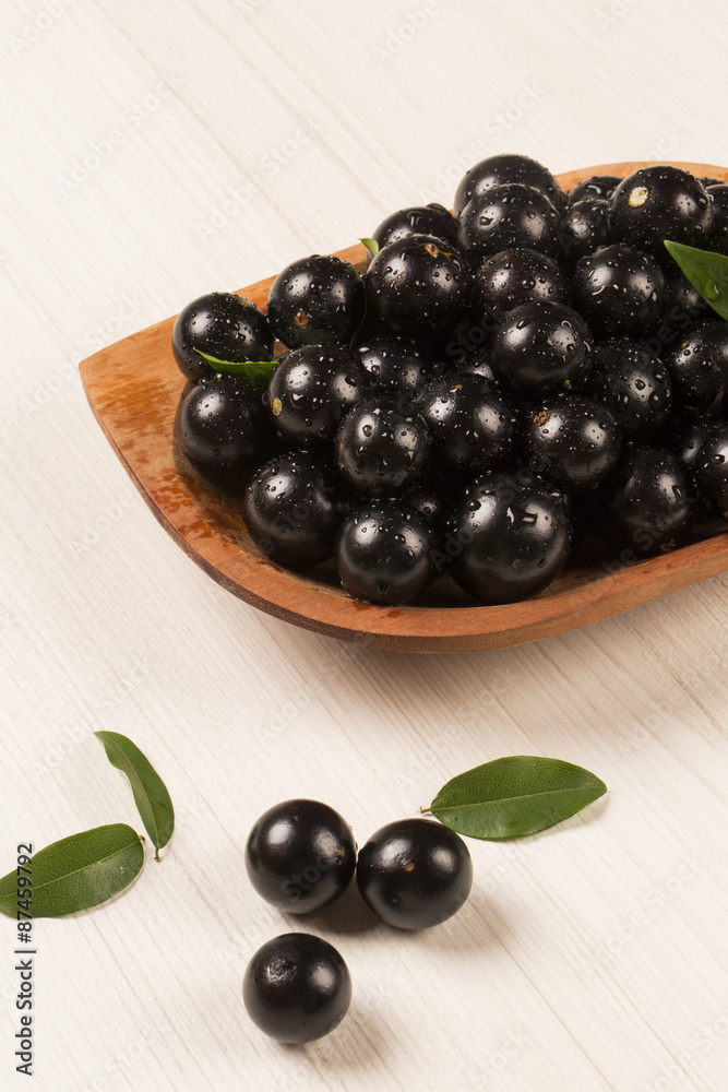 Berry Jaboticaba in bowl on white background Berry Jaboticaba in bowl on white background