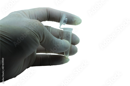 Tube is holding with protective by glove on the white background.