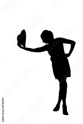 woman silhouette taking off a hat