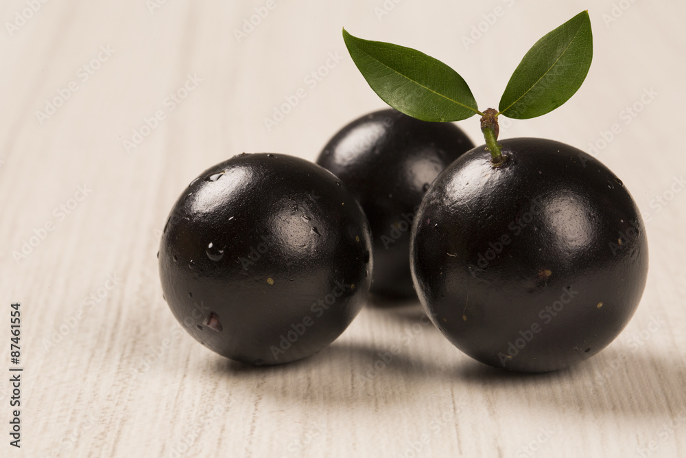 Berry Jaboticaba in bowl on white background Berry Jaboticaba in bowl on white background